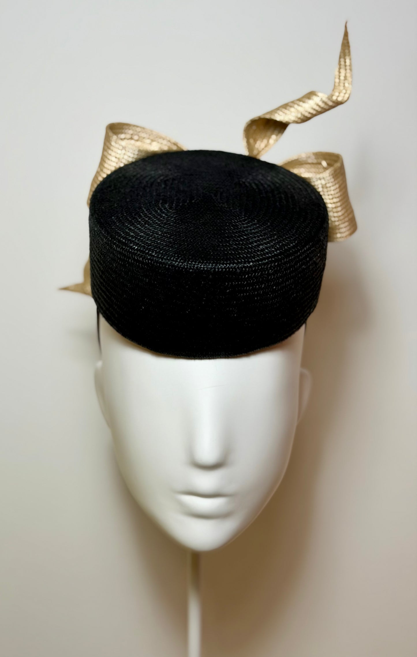 Black pillbox with sculptured bow