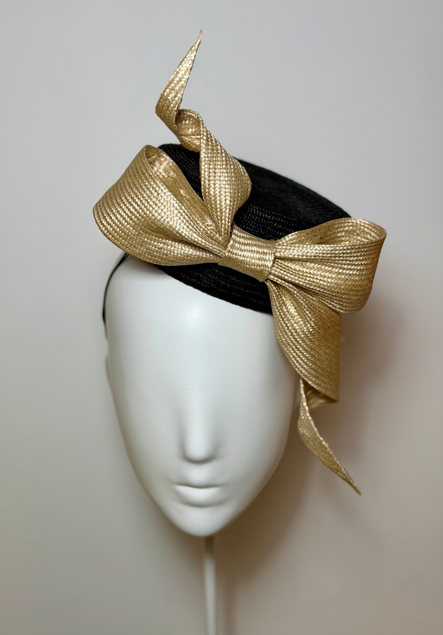 Black pillbox with sculptured bow